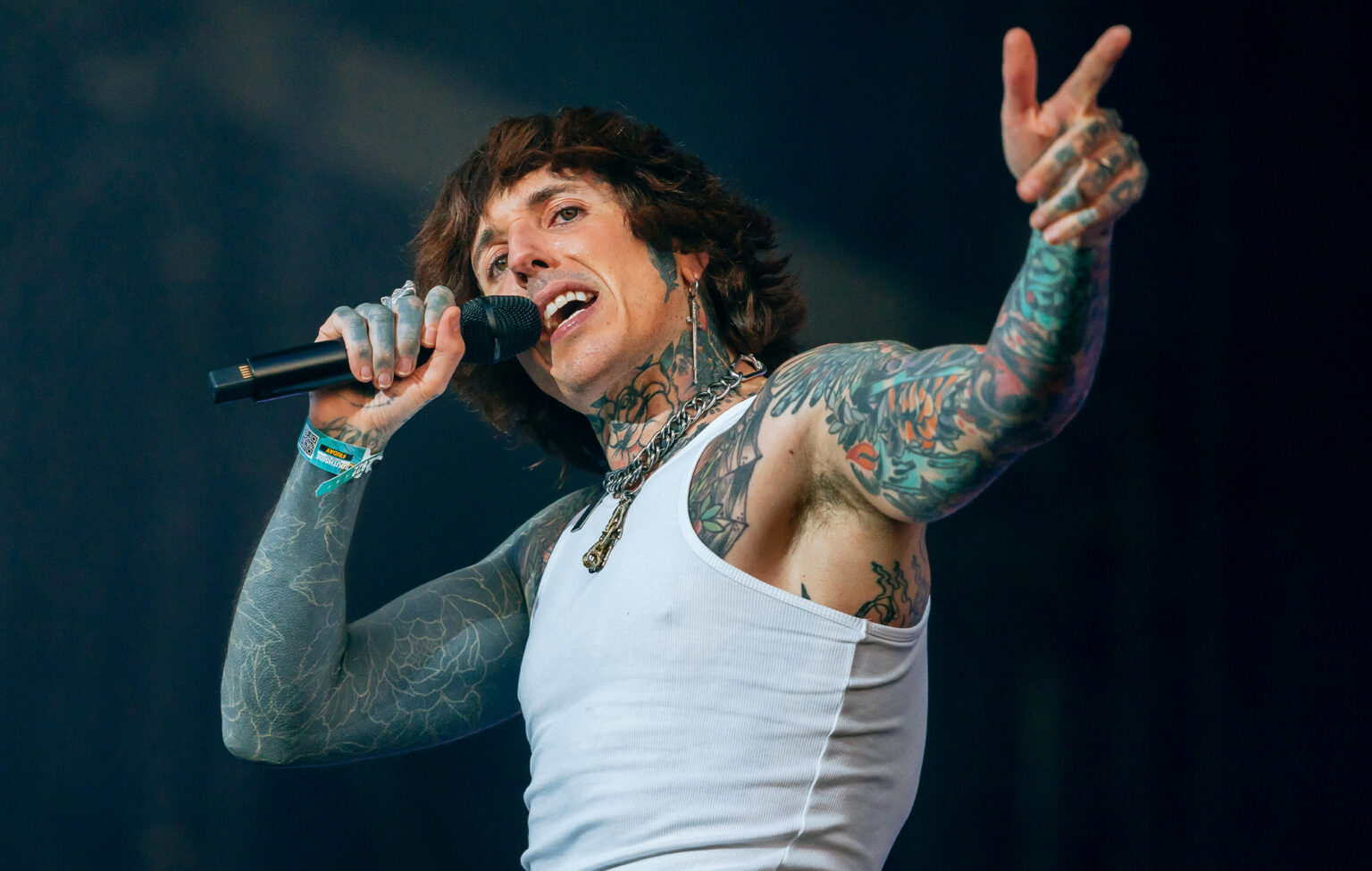 Bring Me The Horizon band performing live on stage with energetic lighting.